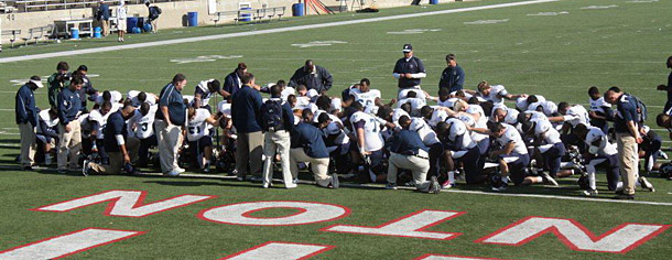 Wesley takes a knee after the game