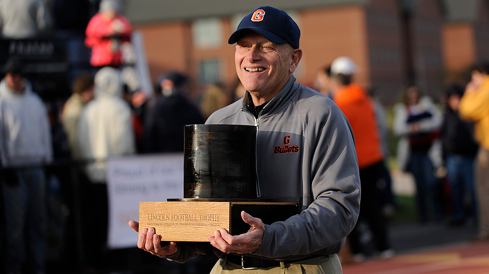 Barry Streeter holds Lincoln Trophy