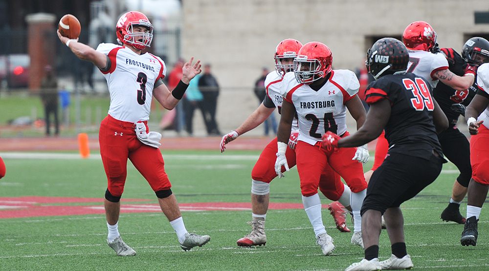 Frostburg State quarterback Connor Cox gets ready to release a pass during the team's second-round playoff game in 2017 at Washington & Jefferson.