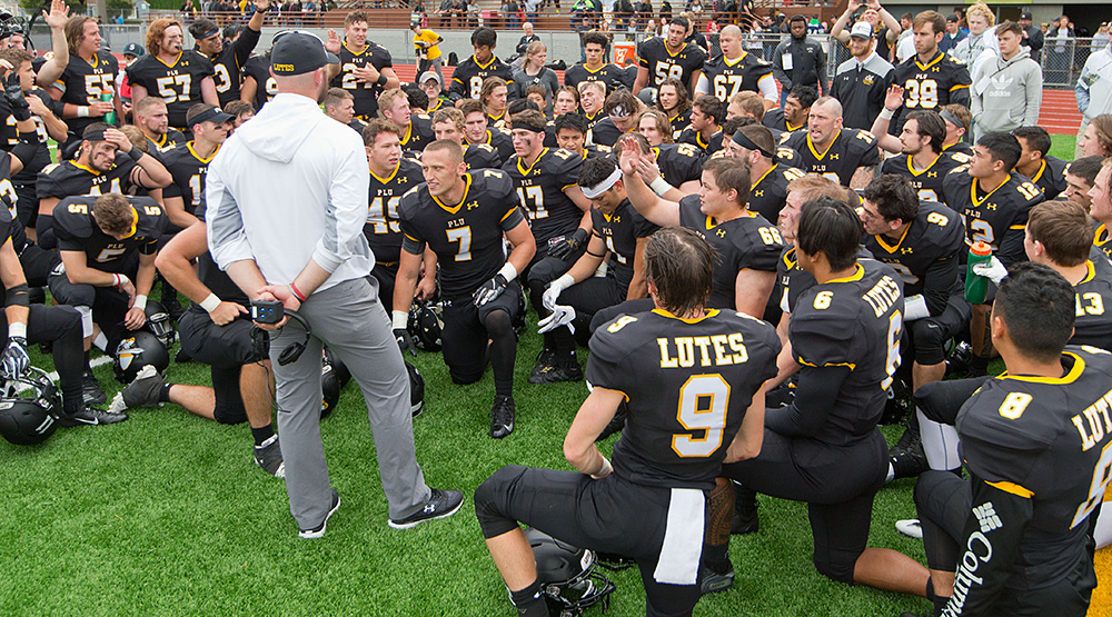 Brant McAdams addresses his Lutes after an early-season game. (Pacific Lutheran athletics photo)