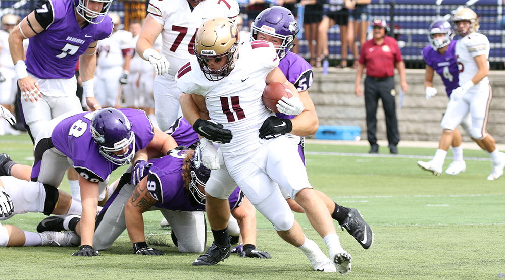 Harry Henschler wraps up one of his 10.5 tackles for loss. (Photo by Daryl Tessmann, d3photography.com)