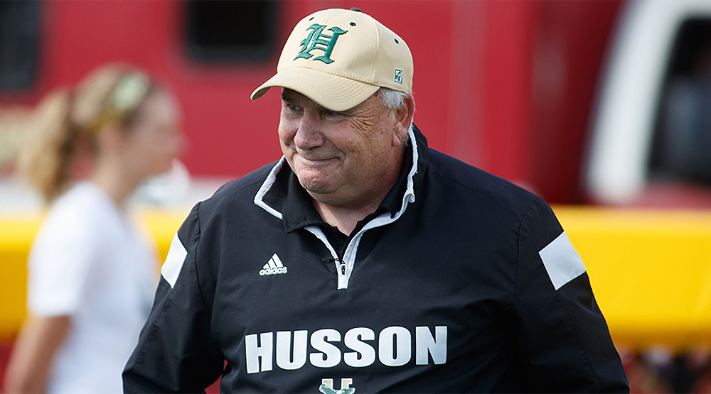 Gabby Price in a Husson cap and windbreaker. (Husson athletics photo)